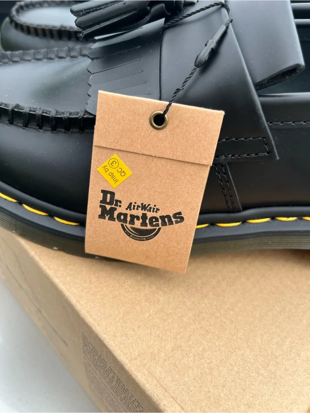 Dr. Martens Black Tassel Kiltie Loafers with Yellow Stitching